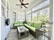 Bright sunroom features comfortable seating, large windows and relaxing space to enjoy the outdoors at 1652 Murrell Pl., Murrells Inlet, SC 29576