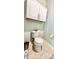 Cozy toilet features neutral paint, white cabinets, and a roll of toilet paper at 1652 Murrell Pl., Murrells Inlet, SC 29576