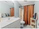 Bathroom with single vanity, modern shower curtain, and brushed nickel hardware at 2 Sunrise Ct., Carolina Shores, NC 28467