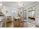 Dining area featuring hardwood floors and open access to screened-in porch at 2 Sunrise Ct., Carolina Shores, NC 28467