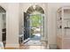 Inviting foyer with hardwood floors, transom window, and view to the front yard at 2 Sunrise Ct., Carolina Shores, NC 28467