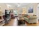 Cozy living room with hardwood floors, television and comfortable seating at 2 Sunrise Ct., Carolina Shores, NC 28467