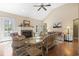 Bright living room featuring a fireplace, ceiling fan, and access to the outdoors at 2 Sunrise Ct., Carolina Shores, NC 28467