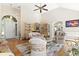 Open-concept living room with fireplace, hardwood floors, and easy access to other rooms at 2 Sunrise Ct., Carolina Shores, NC 28467