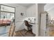 Home office features white cabinets and view into screened-in porch at 2 Sunrise Ct., Carolina Shores, NC 28467