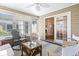 Bright sunroom features hardwood floors and sliding glass doors at 2 Sunrise Ct., Carolina Shores, NC 28467