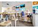 Cozy bar featuring multiple TV screens, countertop seating, and a lively atmosphere at 2001 S Ocean Blvd. # 720, Myrtle Beach, SC 29577