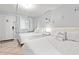 Bright bedroom featuring two beds with white bedding, tile flooring, and beach themed decorations at 2001 S Ocean Blvd. # 720, Myrtle Beach, SC 29577