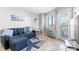 Cozy living room featuring a sofa with a pullout bed, a nautical rug, and a balcony view at 2001 S Ocean Blvd. # 720, Myrtle Beach, SC 29577