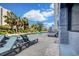 Outdoor pool area with lounge chairs and palm trees creating a relaxing resort-style experience at 2001 S Ocean Blvd. # 720, Myrtle Beach, SC 29577