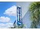 A blue sign on the corner of a building for Clearwater with palm trees and blue sky at 2001 S Ocean Blvd. # 720, Myrtle Beach, SC 29577