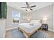 Comfortable bedroom with a queen-size bed, ample natural light, and stylish furnishings, perfect for rest and relaxation at 201-E Madison Ct., Myrtle Beach, SC 29577
