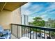 Balcony view of parking and building on sunny day with patio furniture and black railing at 210 75Th Ave. N # 4034, Myrtle Beach, SC 29572