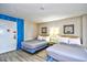 Inviting bedroom featuring two beds, bedside table, lamps, and cozy bedding at 210 75Th Ave. N # 4034, Myrtle Beach, SC 29572