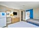 Comfortable bedroom with twin beds, dresser, TV, and storage space for a relaxing stay at 210 75Th Ave. N # 4034, Myrtle Beach, SC 29572