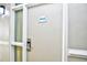 Unit 4034 door with white trim and hardware, alongside an outdoor light at 210 75Th Ave. N # 4034, Myrtle Beach, SC 29572