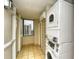 Hallway laundry room complete with stackable washer dryer and tile flooring at 210 75Th Ave. N # 4034, Myrtle Beach, SC 29572