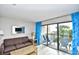 Bright living room offering natural light, balcony access, and comfortable furnishings at 210 75Th Ave. N # 4034, Myrtle Beach, SC 29572