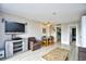 Open-concept living area with flat screen tv, dining area, and modern wood look floors at 210 75Th Ave. N # 4034, Myrtle Beach, SC 29572