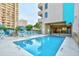 Outdoor pool area perfect for relaxation on a sunny day with poolside seating at 210 75Th Ave. N # 4034, Myrtle Beach, SC 29572