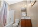 Bathroom featuring a shower-tub combo, single vanity, and ample lighting at 213 76Th Ave. N, Myrtle Beach, SC 29577