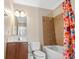 Bright bathroom features a shower-tub combination and a single sink vanity at 213 76Th Ave. N, Myrtle Beach, SC 29577