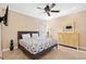 This bedroom includes a queen-sized bed and a dresser with a mirror at 213 76Th Ave. N, Myrtle Beach, SC 29577