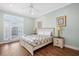 Comfortable bedroom featuring a queen size bed, ceiling fan, and natural lighting at 213 76Th Ave. N, Myrtle Beach, SC 29577