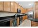 Well-equipped kitchen featuring stainless steel appliances and black granite countertops at 213 76Th Ave. N, Myrtle Beach, SC 29577