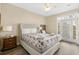 A view of the main bedroom featuring a king bed and access to an outdoor patio at 213 76Th Ave. N, Myrtle Beach, SC 29577