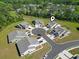 Aerial view of homes in a cul-de-sac surrounded by lush trees, showcasing a peaceful neighborhood at 216 Kinross Ct., Little River, SC 29566