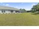 Expansive backyard with a well-maintained lawn and screened patio, ideal for outdoor activities and gatherings at 216 Kinross Ct., Little River, SC 29566