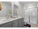 Bathroom featuring double sinks, vanity, and shower at 216 Kinross Ct., Little River, SC 29566