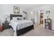 Comfortable bedroom with dark wood furniture, ensuite bathroom, and closet access at 216 Kinross Ct., Little River, SC 29566