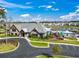 Stunning clubhouse and pool area overlooking the lake with beautiful landscaping and nearby neighborhood amenities at 216 Kinross Ct., Little River, SC 29566
