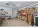 Spacious garage features organized shelving, a workbench, and ample storage space for tools and projects at 216 Kinross Ct., Little River, SC 29566