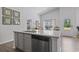 Bright kitchen with granite countertops, a stainless steel dishwasher, and an open view of the dining area at 216 Kinross Ct., Little River, SC 29566