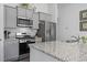 Stylish kitchen featuring granite countertops, stainless steel appliances, and modern cabinetry at 216 Kinross Ct., Little River, SC 29566