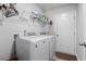 Convenient laundry room with modern washer and dryer, plus shelving for storage, making chores a breeze at 216 Kinross Ct., Little River, SC 29566
