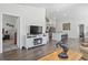 Open-concept living room with modern finishes and kitchen access at 216 Kinross Ct., Little River, SC 29566