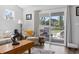 Bright living room featuring a sliding glass door to the outdoor deck area at 216 Kinross Ct., Little River, SC 29566