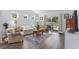 Comfortable living room with hardwood floors, cozy seating, and natural light from sliding glass doors at 216 Kinross Ct., Little River, SC 29566