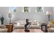 Cozy living room featuring neutral tones, bright windows, and stylish decor at 216 Kinross Ct., Little River, SC 29566
