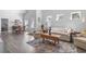 Inviting living room with hardwood floors, a neutral palette, and a dining area at 216 Kinross Ct., Little River, SC 29566