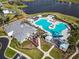 Aerial view of community pool and clubhouse with expansive pool decks and seating areas at 216 Kinross Ct., Little River, SC 29566