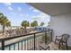 Balcony view overlooking lazy river pool, palm trees and sandy beach at 3000 N Ocean Blvd. # 130, Myrtle Beach, SC 29577