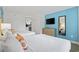 Bedroom with two cozy beds, a flat screen TV, and a view of the kitchen at 3000 N Ocean Blvd. # 130, Myrtle Beach, SC 29577
