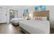 Bright bedroom with two queen beds, beach-themed decor, and a private balcony at 3000 N Ocean Blvd. # 130, Myrtle Beach, SC 29577