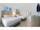 Comfortable bedroom with two beds, en-suite bathroom and beach-themed decor at 3000 N Ocean Blvd. # 130, Myrtle Beach, SC 29577