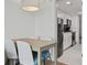 Eat-in dining area features a table with four chairs and is adjacent to the modern kitchen at 3000 N Ocean Blvd. # 130, Myrtle Beach, SC 29577